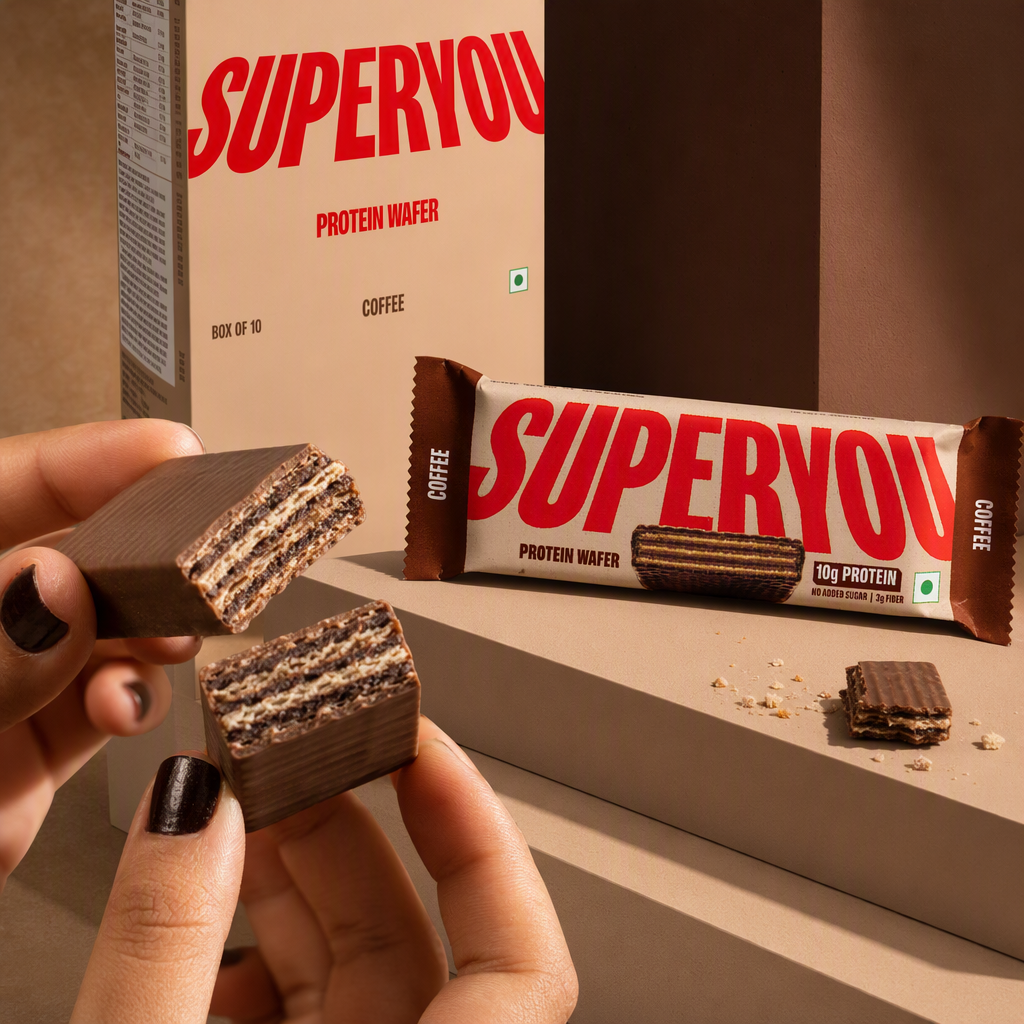 Clean 1:1 square of a SuperYou coffee protein wafer with the bar broken open beside its box